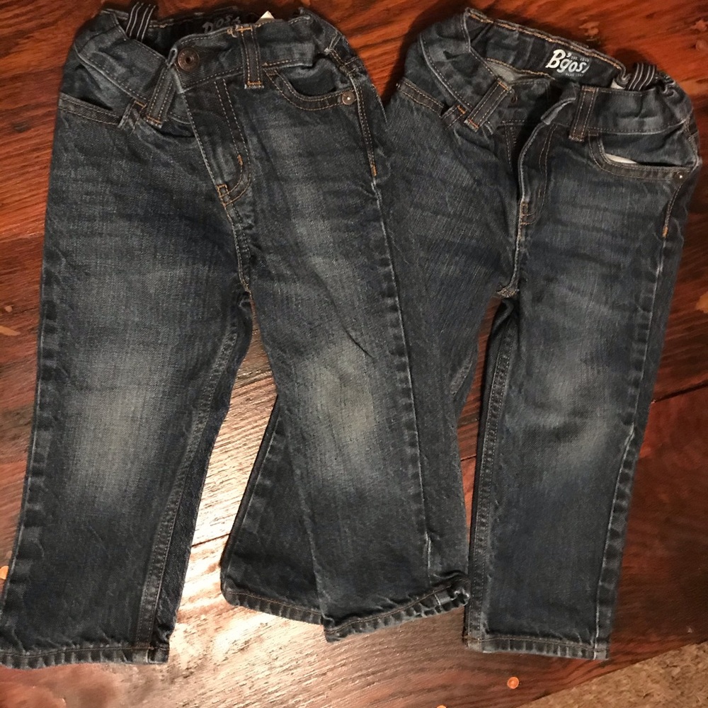 Two pairs of Osh Kosh jeans.